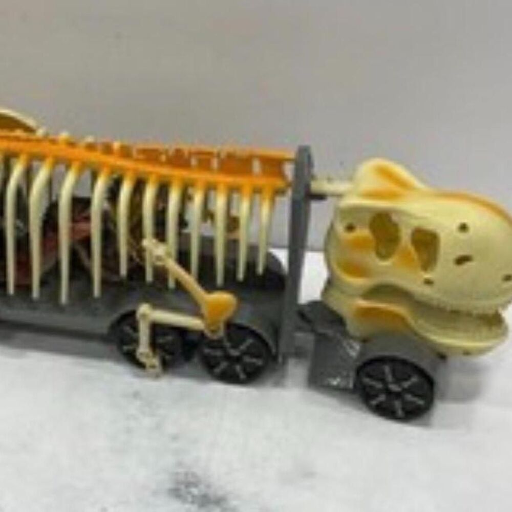 Kid Galaxy 24-inch dinosaur skeleton transport truck or car carrier toy.